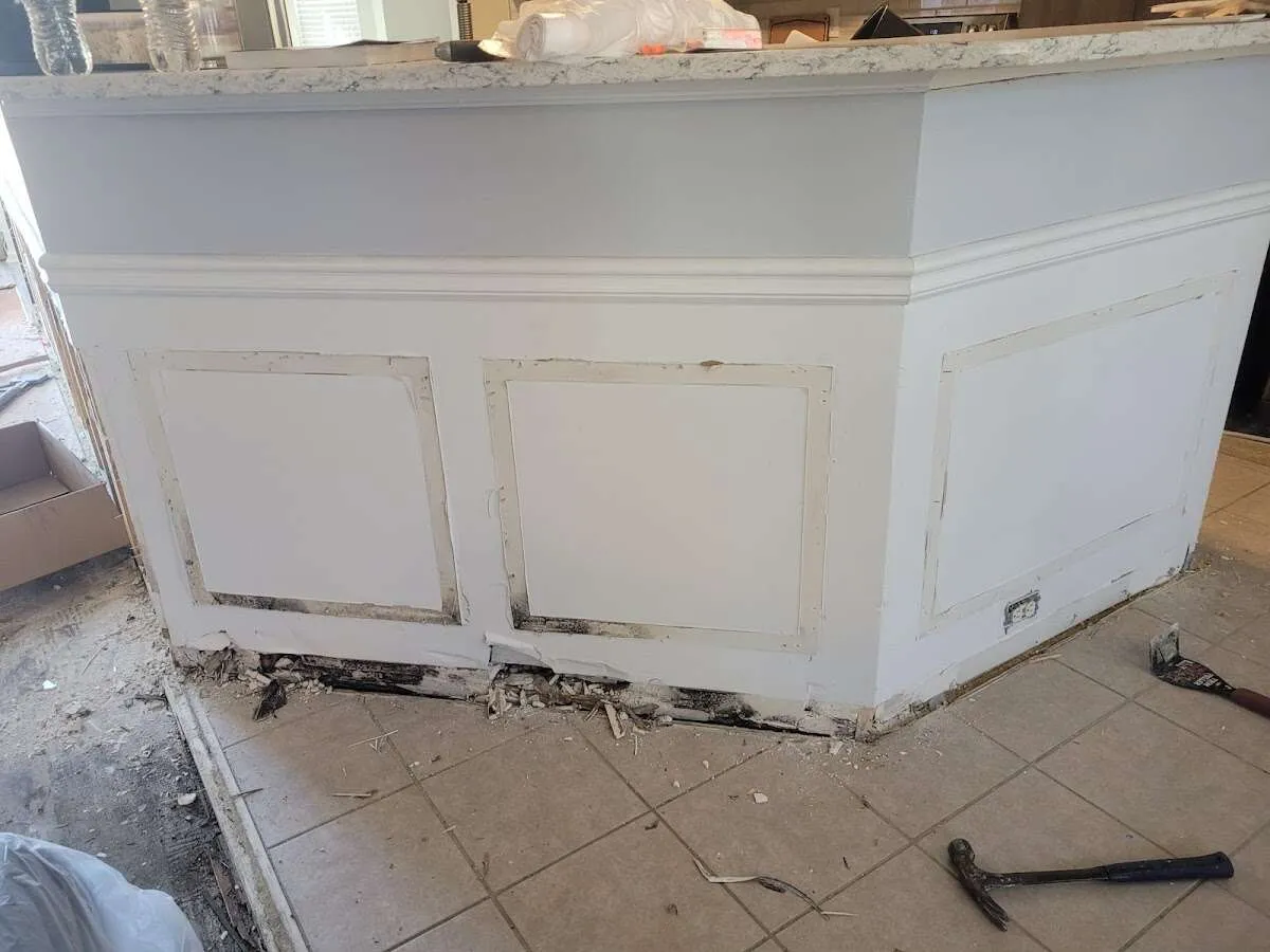 Water damage and mold on kitchen during Sewage Cleanup & Sanitation in Woodmere
